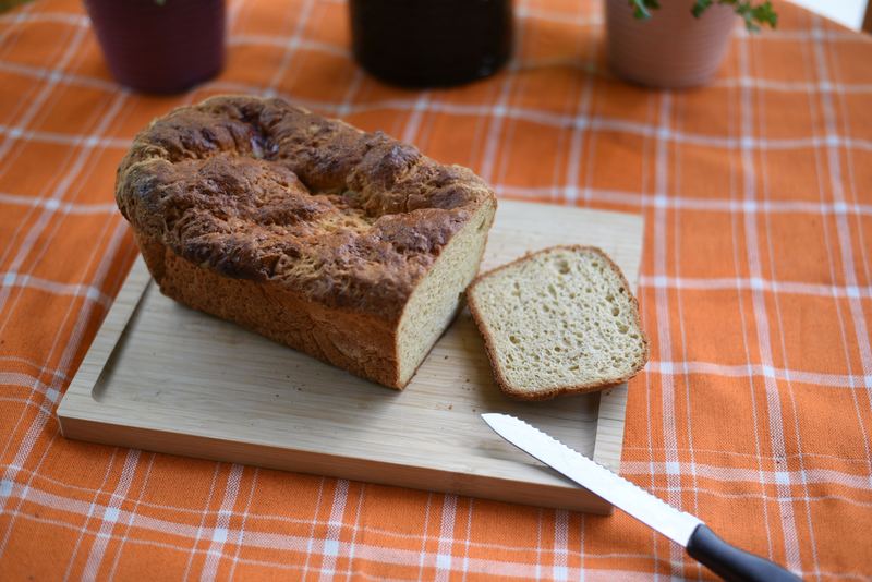 Sliced gluten-free sandwich bread on a wooden board