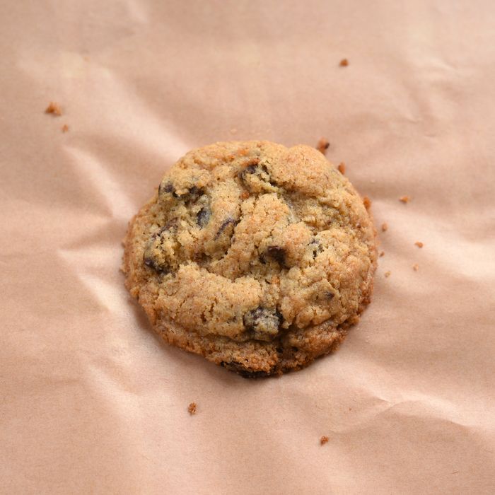 A brown butter chocolate chip cookie on parchment